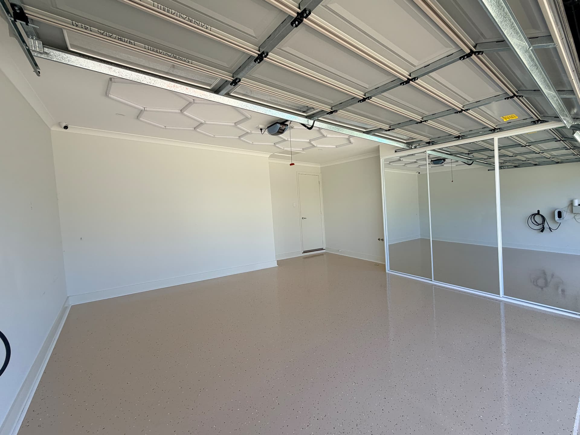 Same garage finished with a flaked epoxy floor system by Master Seal
